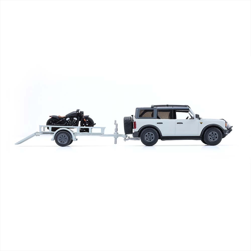Bronco 4-Door Badlands in Cactus Grey with Utility Trailer and Motorcycle